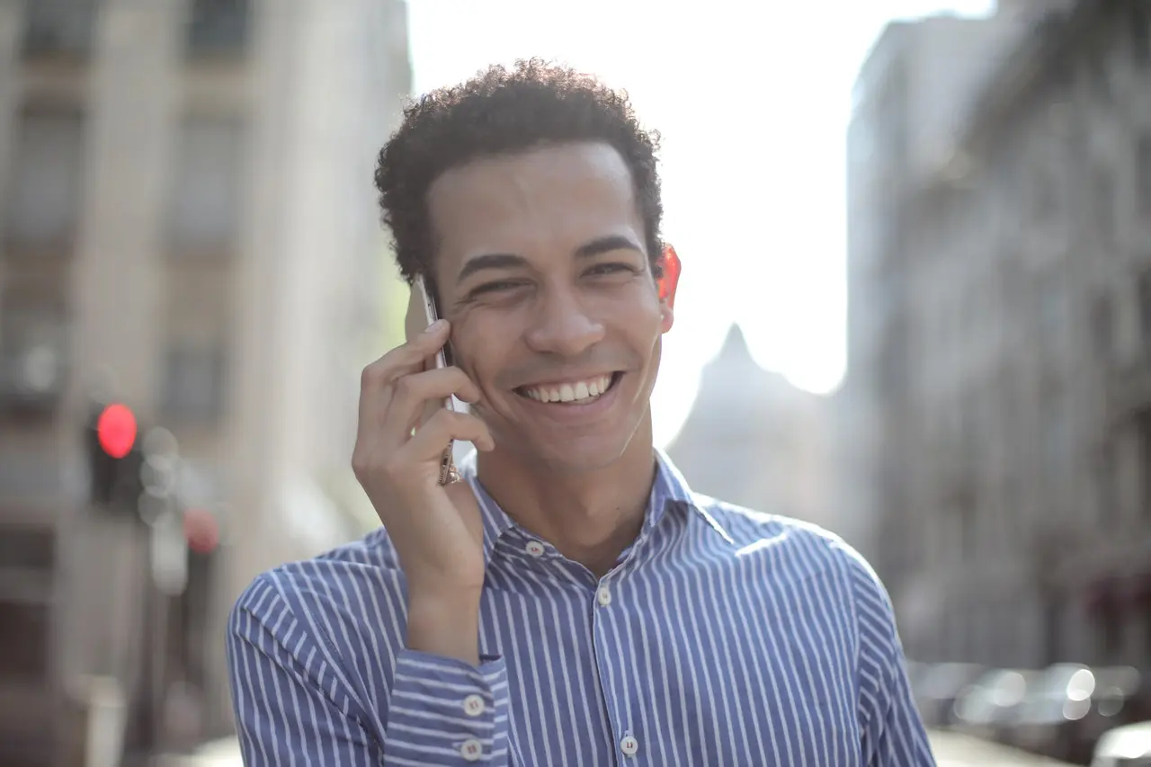 adult with Spanish accent on phone for speech therapy