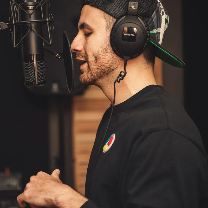 young man using voice to sing or during a podcast in the GTA